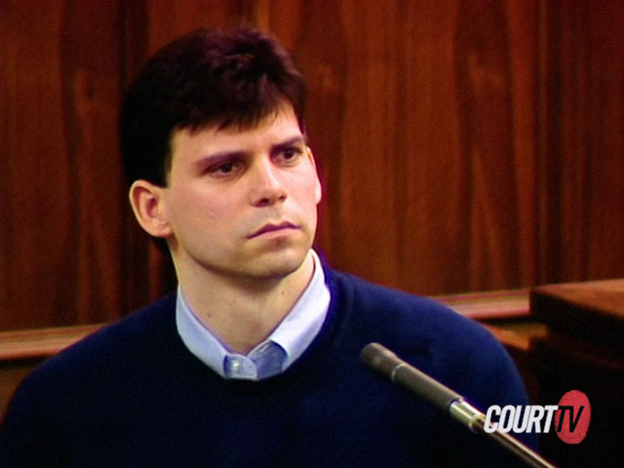 Man in a courtroom setting wearing a dark sweater, associated with Menendez Brothers' legal case. Man in a courtroom setting wearing a dark sweater, associated with Menendez Brothers' legal case.