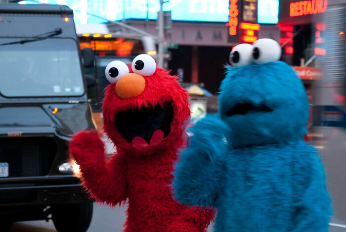 Elmo and Cookie Monster in the street 
