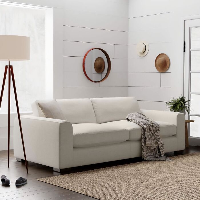 White deep sofa in the room