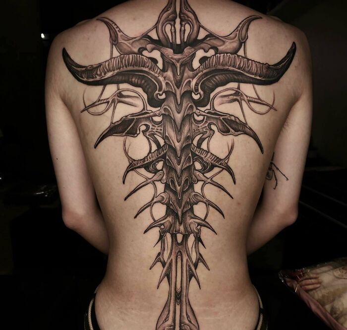 Large devil tattoo on back