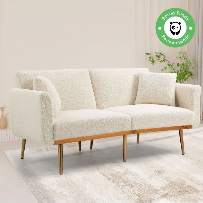 White couch with wooden legs