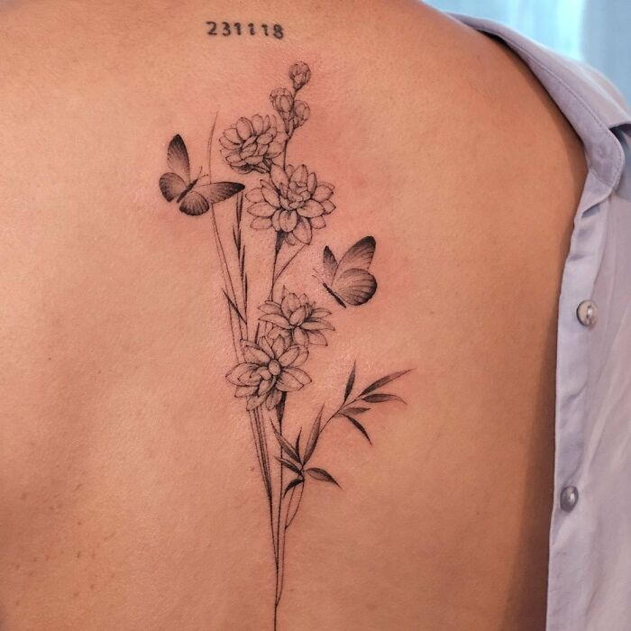 Jasmine flowers and two butterflies tattoo on back