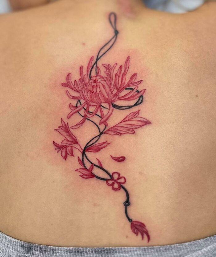 Red chrysanthemum and black thread tattoo