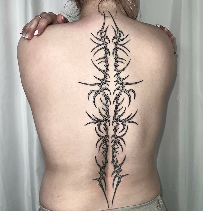 Black large abstract spine tattoo