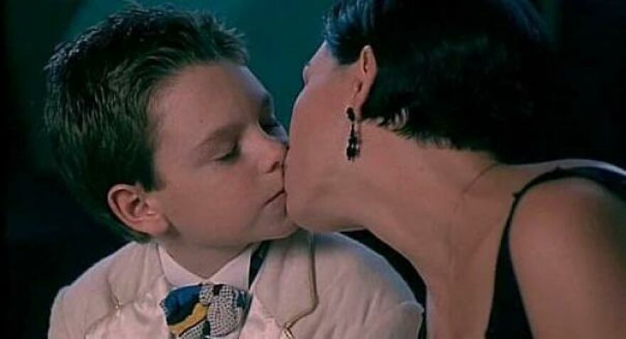 In The Movie Blank Check (1994), The 33 Year Old Female Lead Passionately Kisses The 11 Year Old Protagonist On The Lips. This Actually Ok Because He’s Secretly A 300 Year Old Anime Vampire With Stunted Growth.