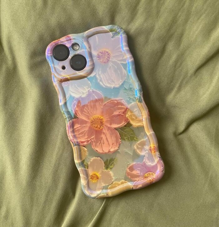 Why Choose Between Gallery-Worthy Design And Gadget Safety? The Colorful Retro Oil Painting Printed Flower Laser Beam Glossy Pattern Phone Case Brings The Brilliance Of Brushstrokes To Your Fingertips, All While Keeping Your Phone's Corners Cushioned.