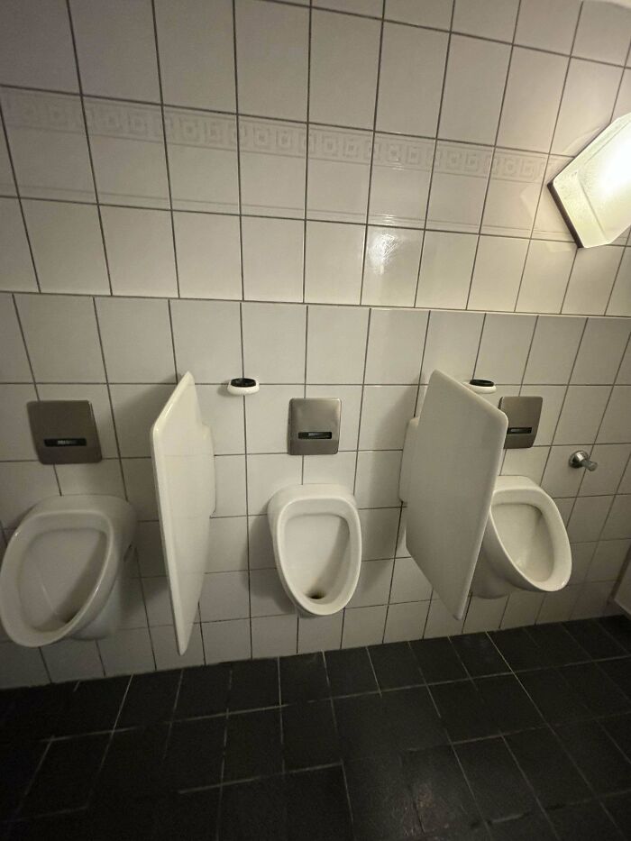 Weirdly Shaped Holding Thingys In A Men’s Bathroom At A German Sports Club Restaurant