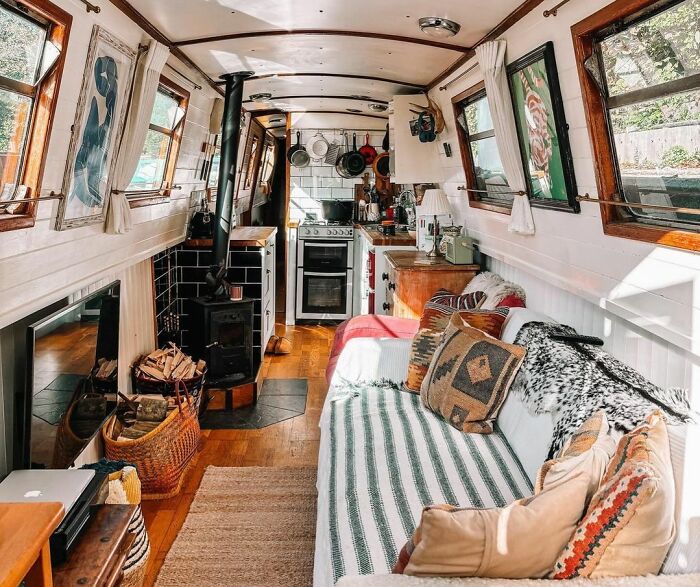 sofa and a small kitchen corner in a house boat