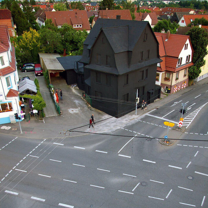 A Strange Black House In The Middle Of The Town
