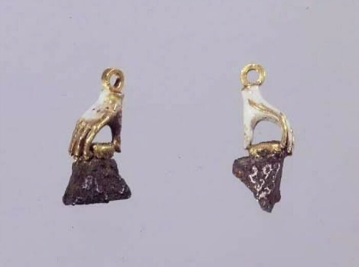 White Gold Enamel Earrings In The Shape Of Little Hands, Which Are Holding Pieces Of The Cannonball Shrapnel That Was Dug Out Of The King Of Denmark's Forehead In 1644