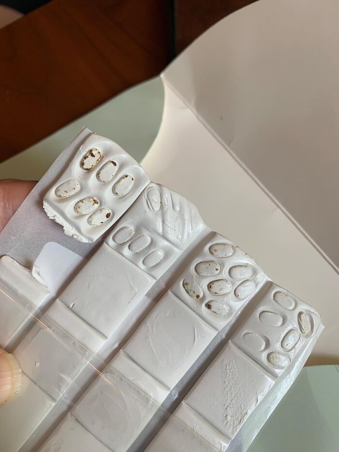 White problem-solving product strips in a blister pack, showcasing their textured surface for simplifying daily tasks.