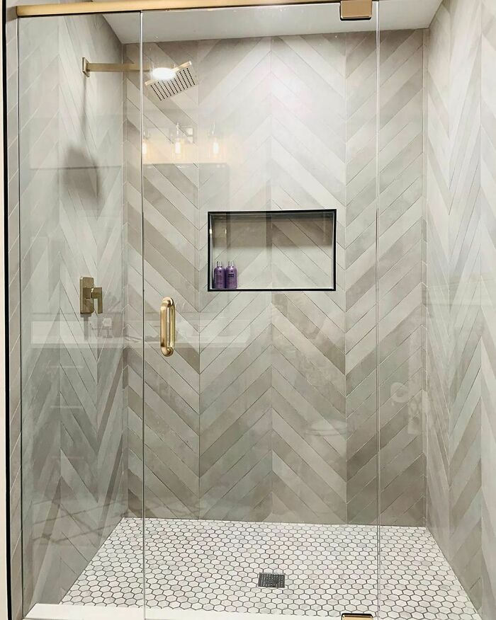 Geometric Patterned tiles in a small walk-in shower 