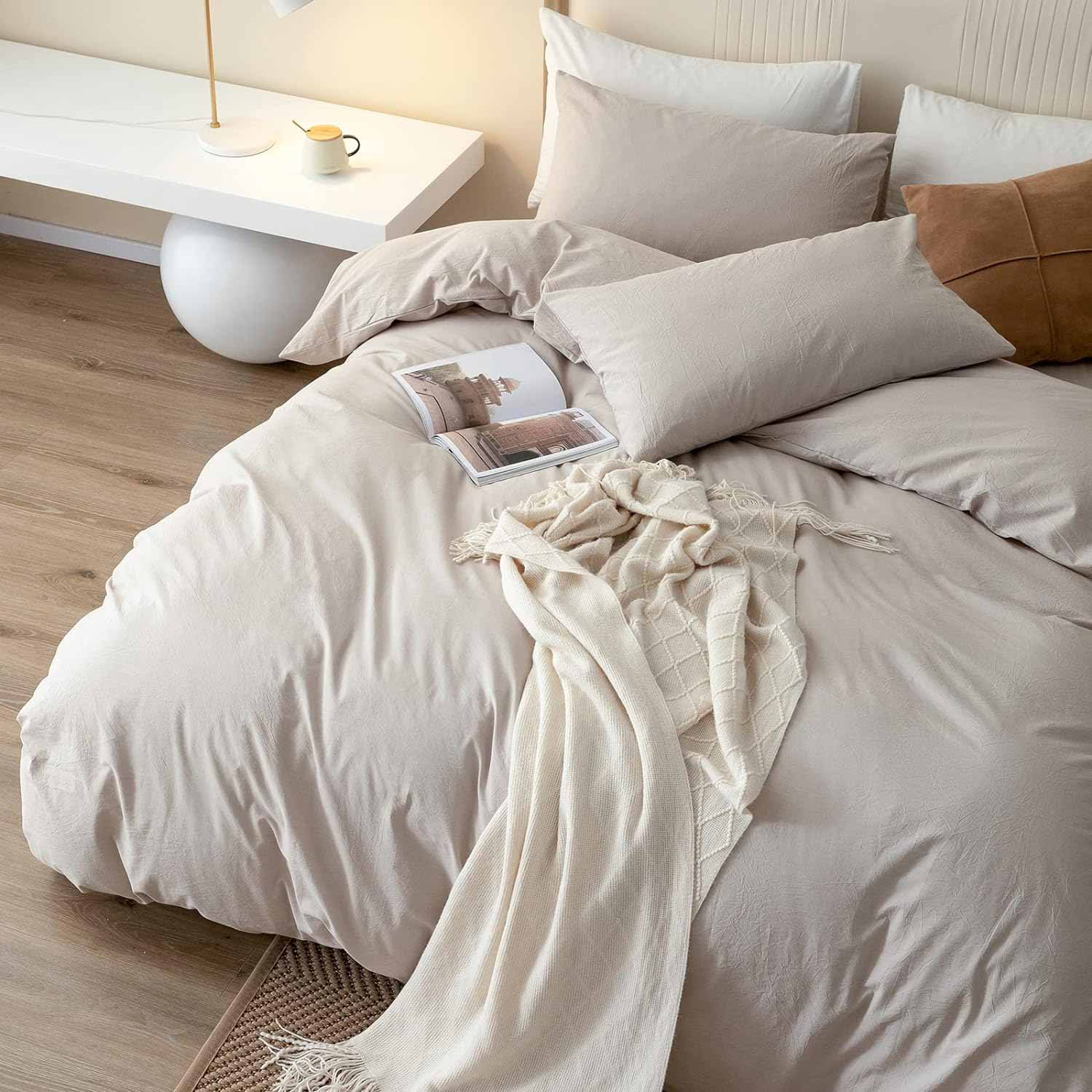 Bed with soft beige bedding Bed with soft beige bedding