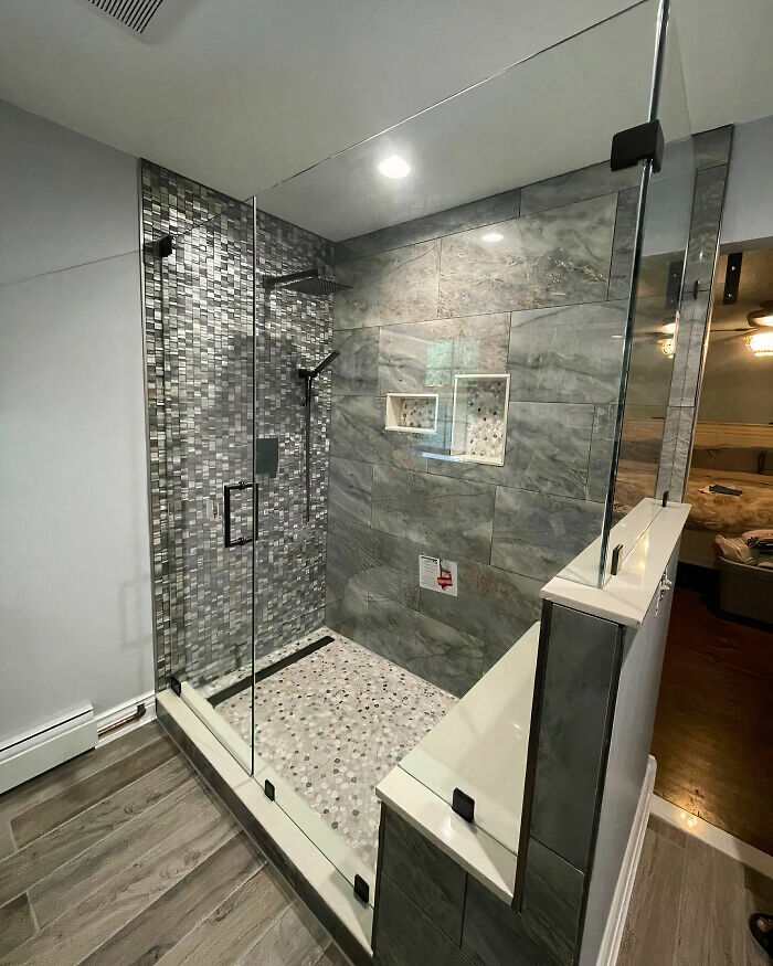White and black L-shaped walk-in shower 