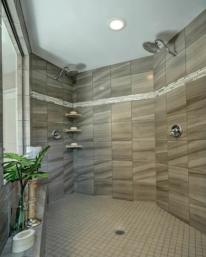 Mix And Match Shaped tiles in a spacious walk-in shower 