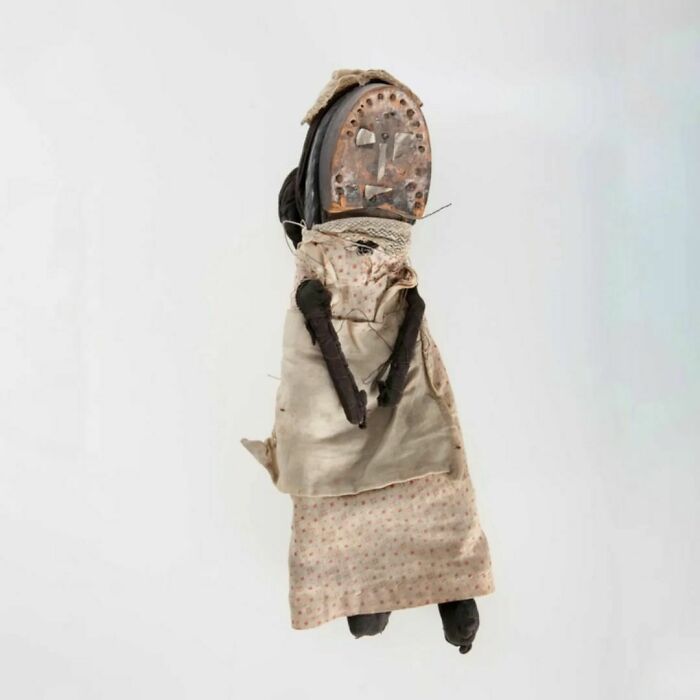 Shoe Doll That Belonged To A Child In The Slums Of London In The Early 20th Century. It Is Handmade From Fabric Scraps And The Heel Of A Man's Delapidated Shoe, With Hair Made From An Old Black Sock