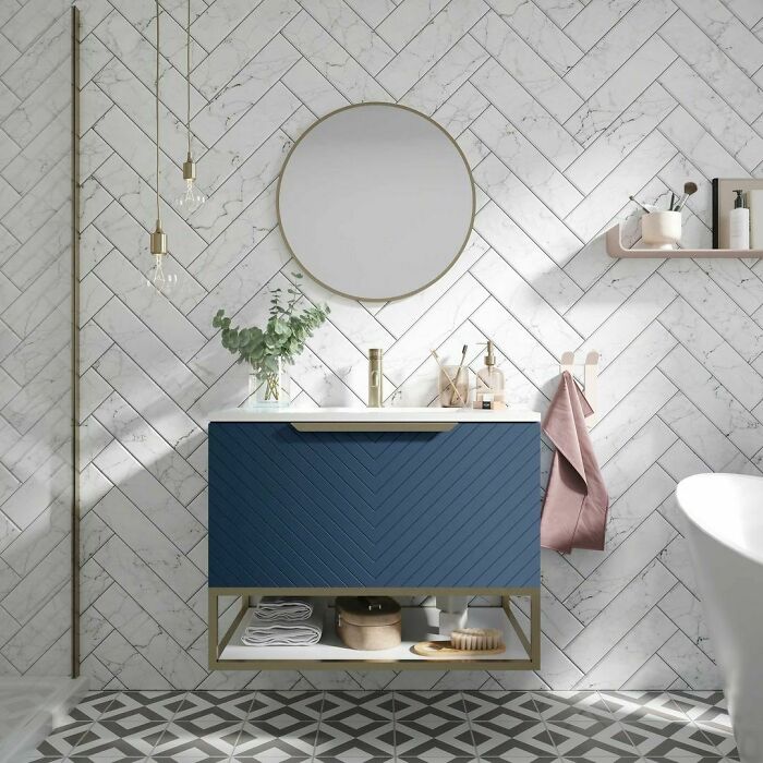 Photo of bathroom with chevron style tiles