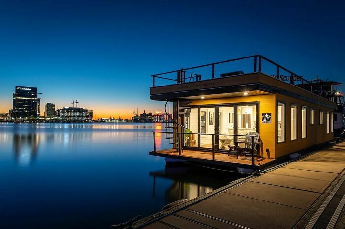 house boat on the water in the evening