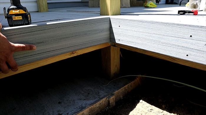 Close-up photo of a skirt board on a floating deck.