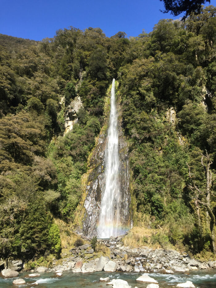 Where Thunder Creek Tumbles Into The Haast River, New Zealand