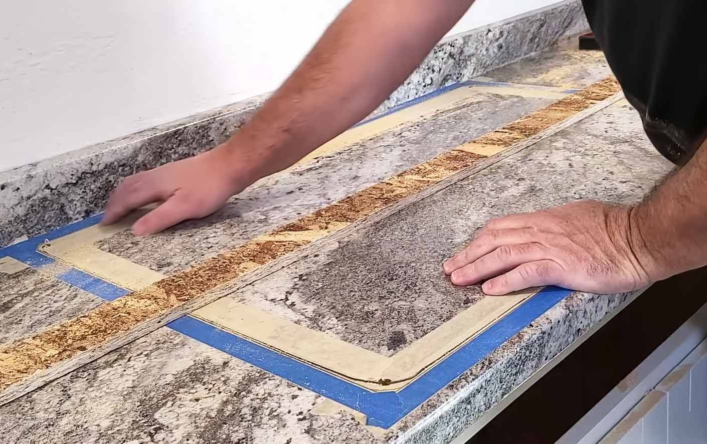A person installing marble laminate countertop