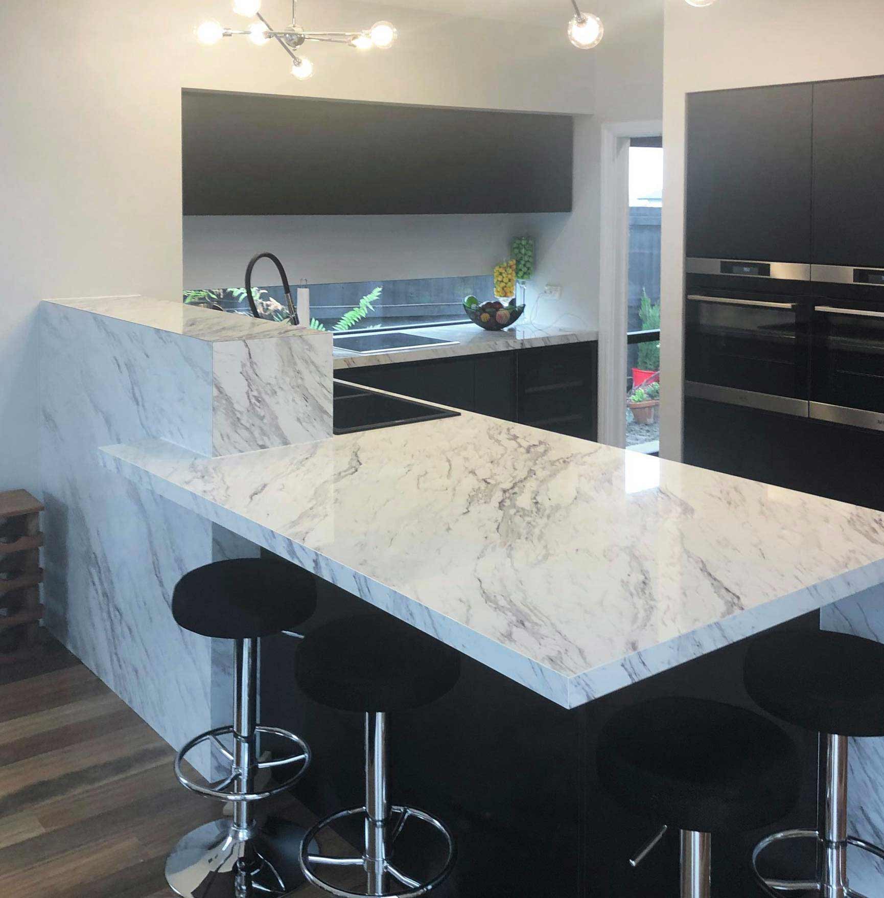 Kitchen with light marble laminate countertop