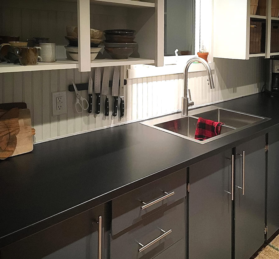 Kitchen with black laminate countertop