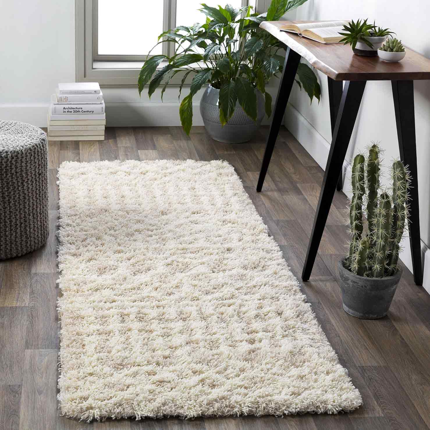 Plush rug on brown wooden floor near the desk Plush rug on brown wooden floor near the desk