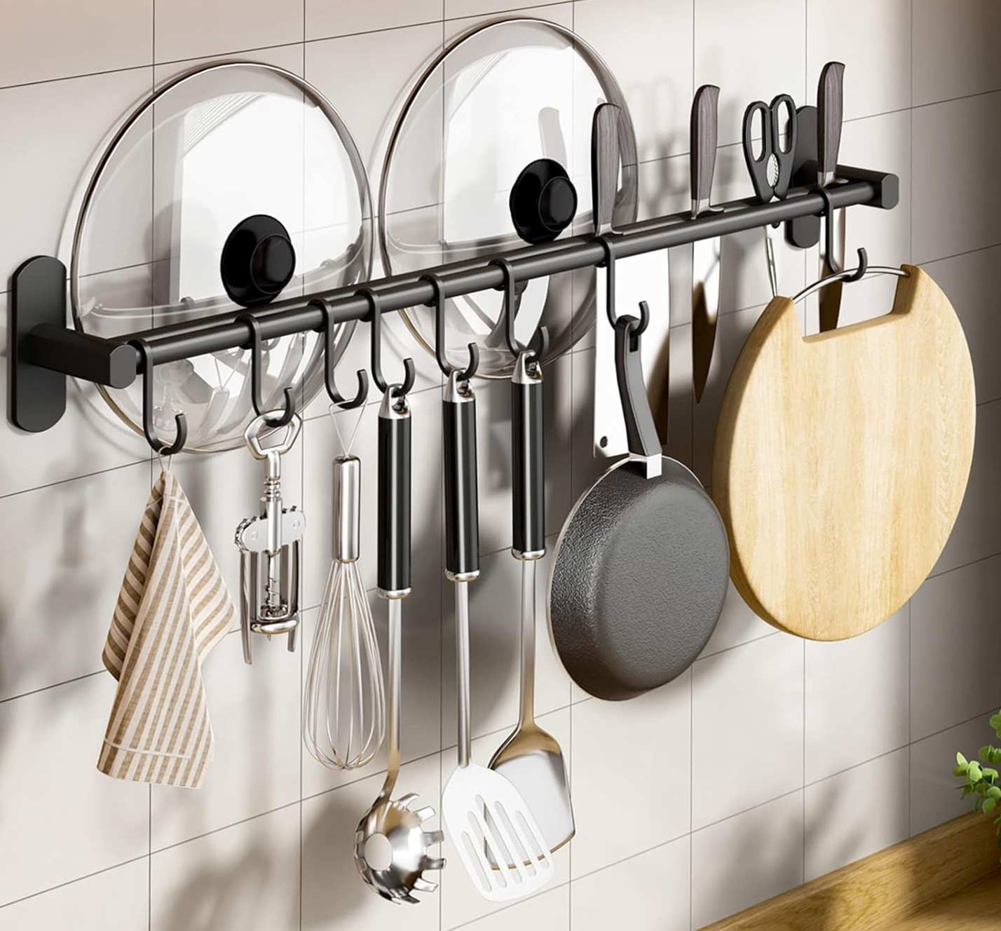 Kitchen organizer on the wall with many cooking tools hung