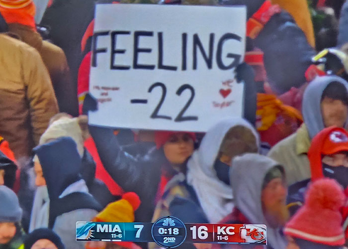 Fans hold a "Feeling -22" sign amid record-cold at Chiefs-Dolphins game, referencing Taylor Swift memes. Fans hold a "Feeling -22" sign amid record-cold at Chiefs-Dolphins game, referencing Taylor Swift memes.