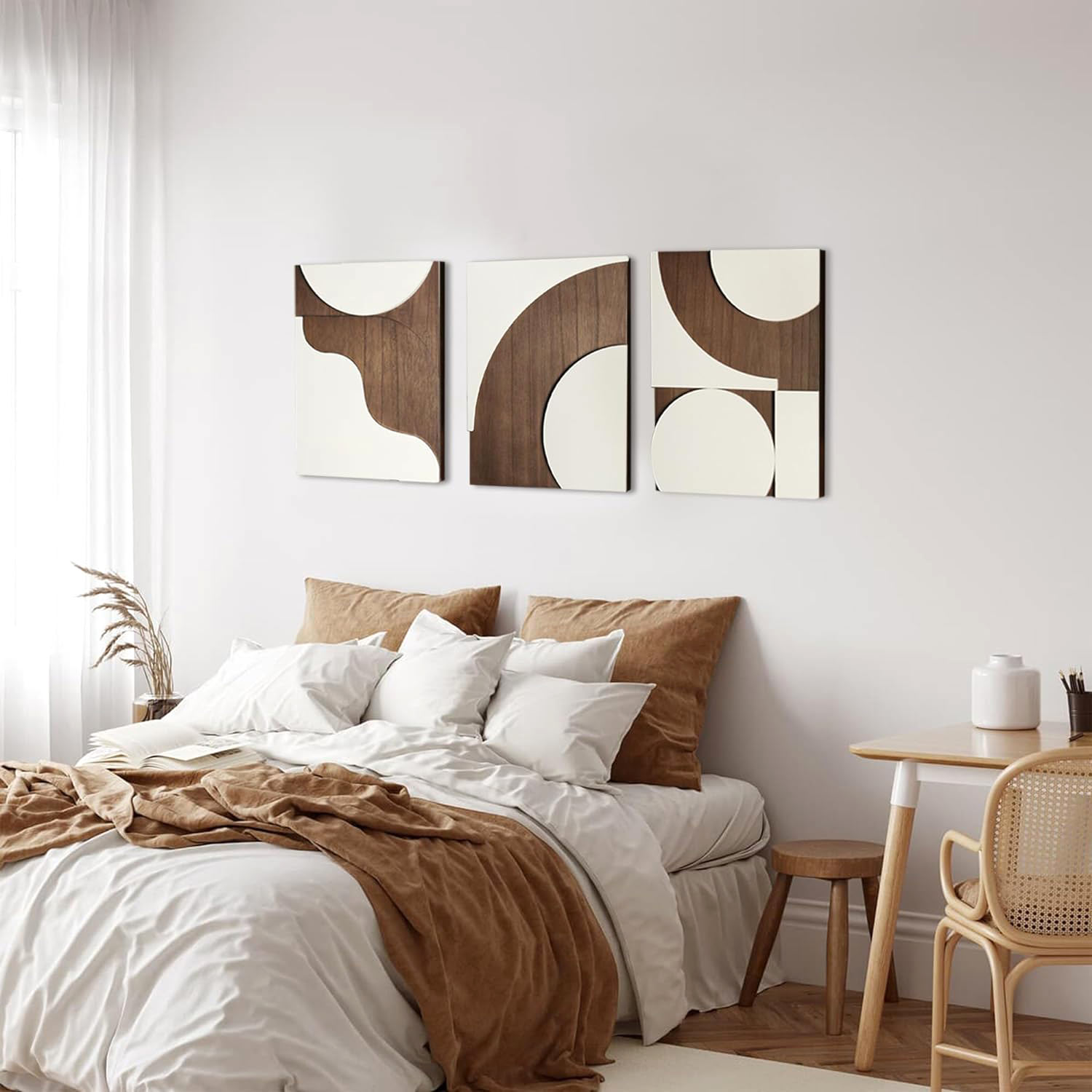 Bedroom with white brown bedding and abstract geometric wall art