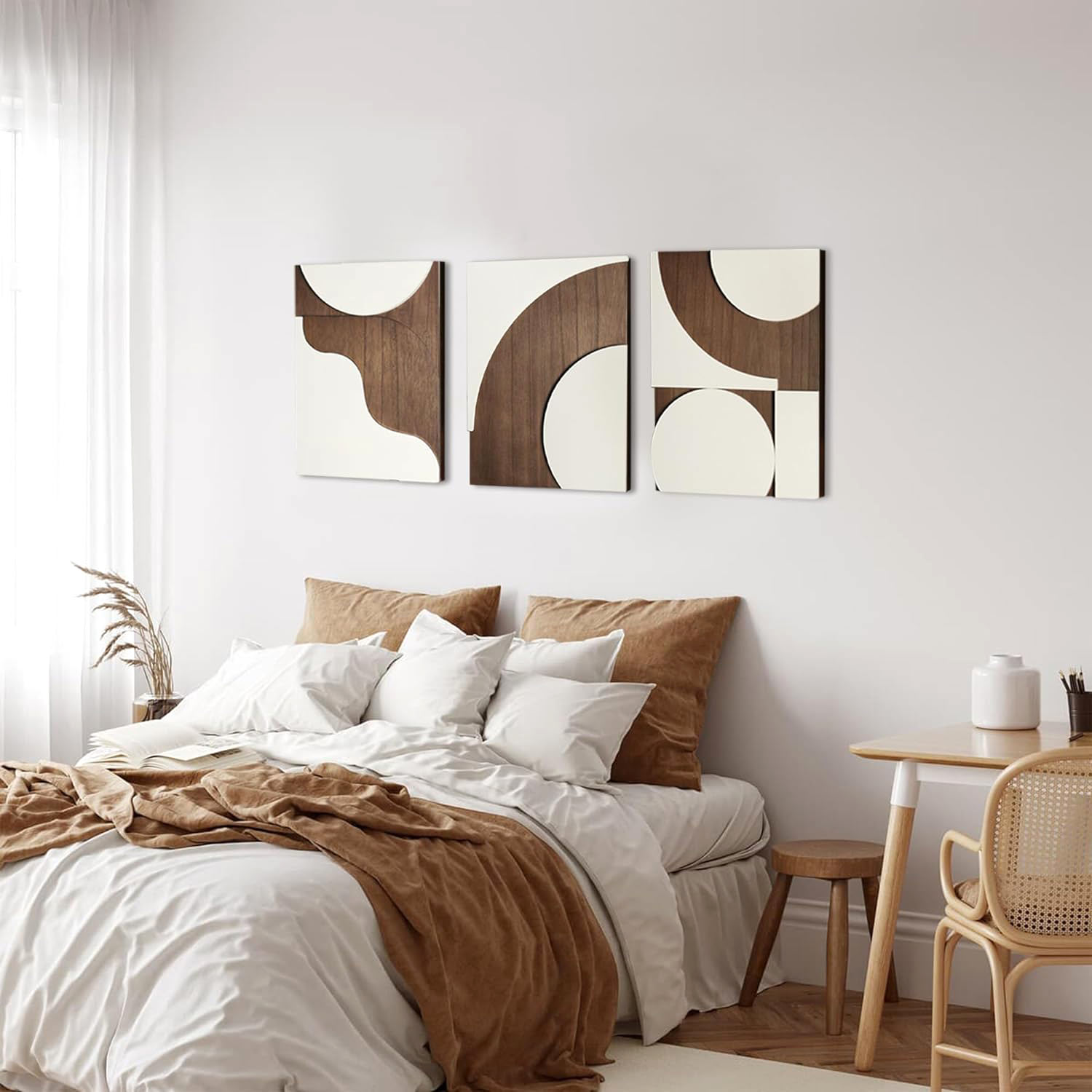 Bedroom with white brown bedding and abstract geometric wall art Bedroom with white brown bedding and abstract geometric wall art
