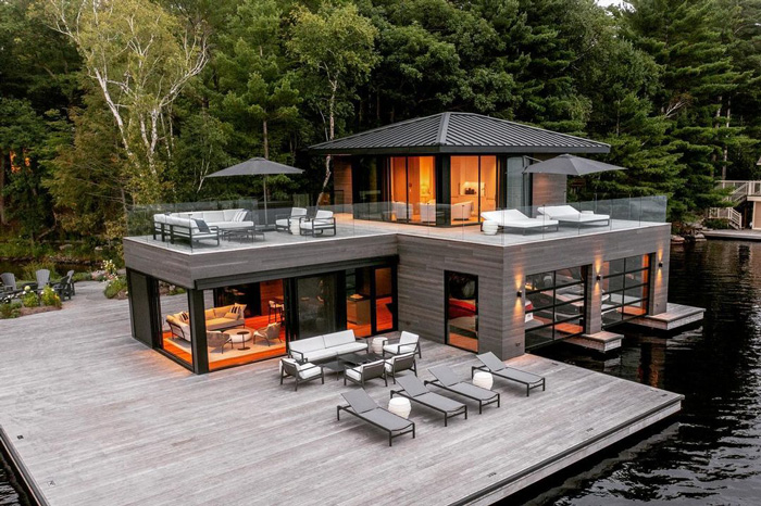 two-story luxury house boat near the forest