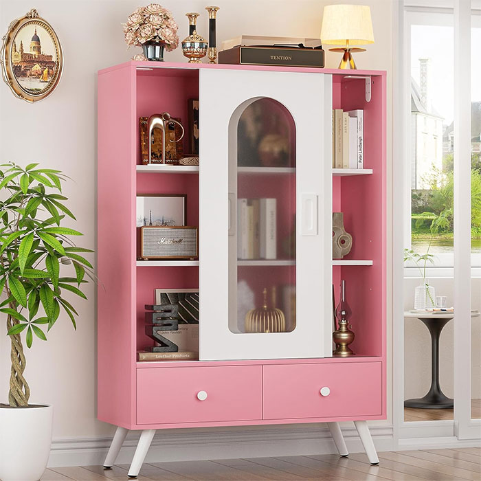 Pink cabinet with sliding doors and shelves