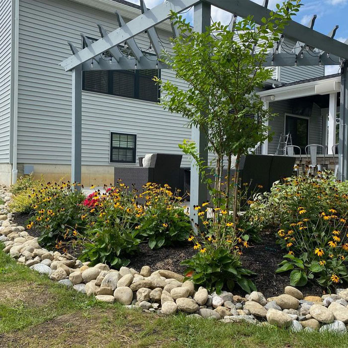 Picture of rock flower bed edging near house