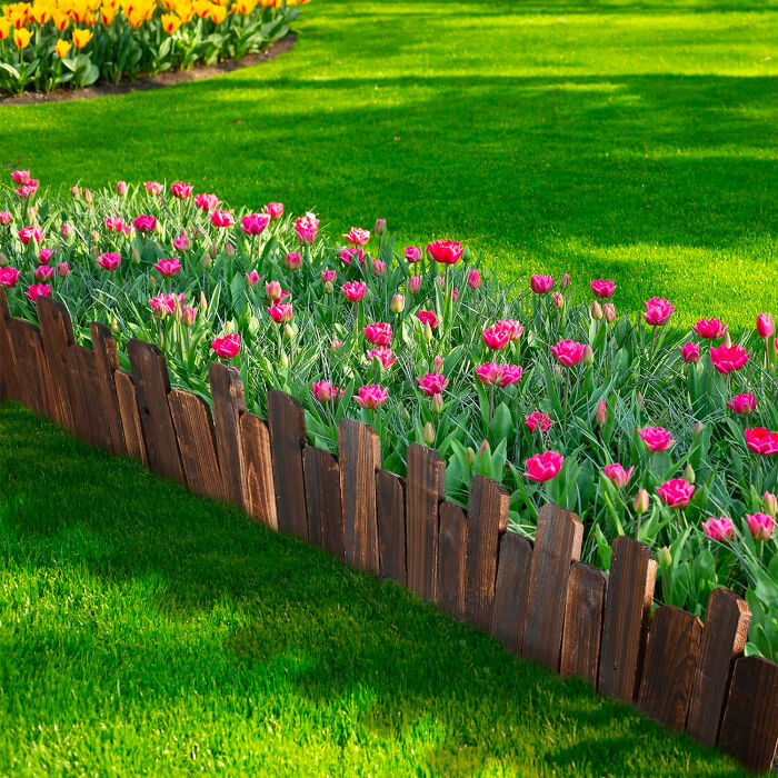 Picture of fence flower bed edging with pink flowers