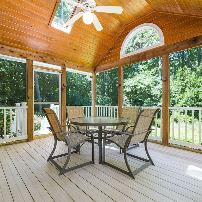 Porch with a ceiling fan and furniture