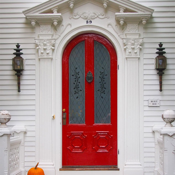 White house with red door and door knocker