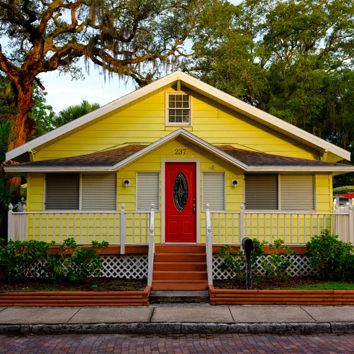 Yellow house with red doors