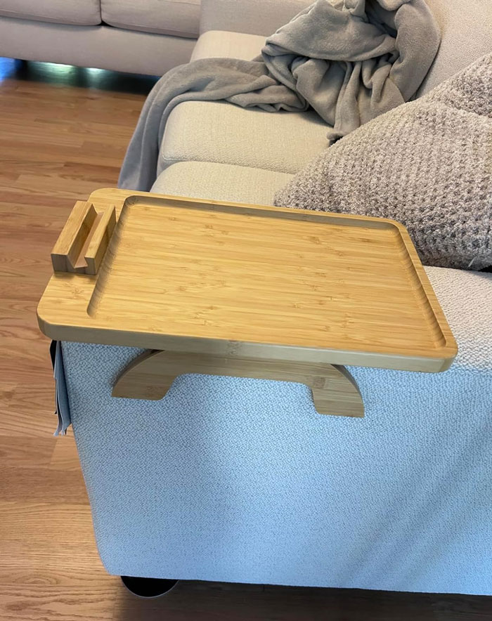 A Space-Saving, Clip-On Bamboo Sofa Table That Provides 360° Phone Viewing, Perfect For Tiny Apartment Dwellers Who Want *Everything* Within Arm's Reach!