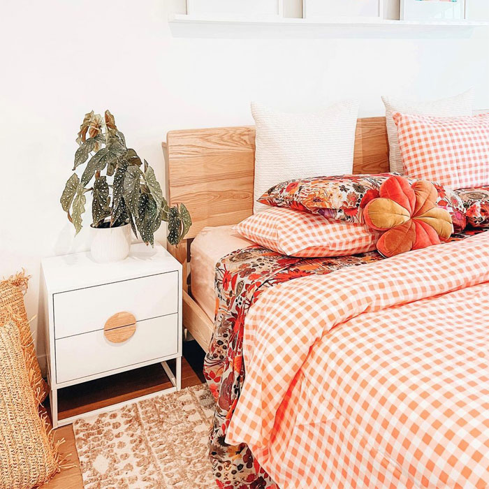 Orange gingham plaid in the bed