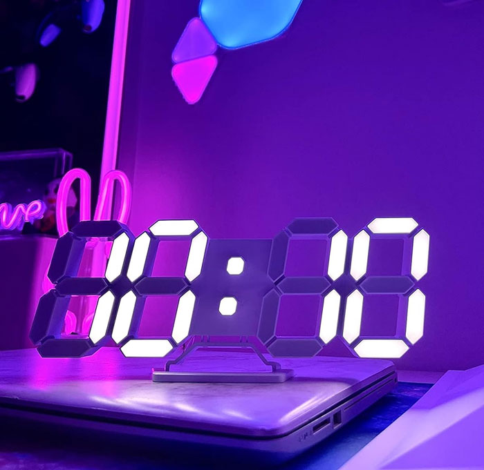 3D LED Digital Wall Clock: That doesn't just help you master time management, but acts as your stylish night light, a subtle alarm clock, and an interior embellishment - it's decked out with automatic brightness adjustment and a hangable design to prove clocks are never just about ticking!