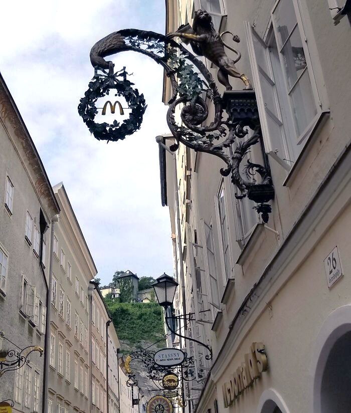 This McDonald's Sign Has Been Made To Match The Old Street That It Is On - Salzburg, Austria
