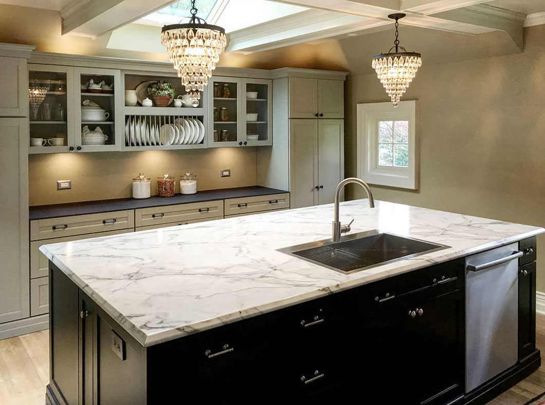 Kitchen with light marble laminate countertop and two chandeliers Kitchen with light marble laminate countertop and two chandeliers