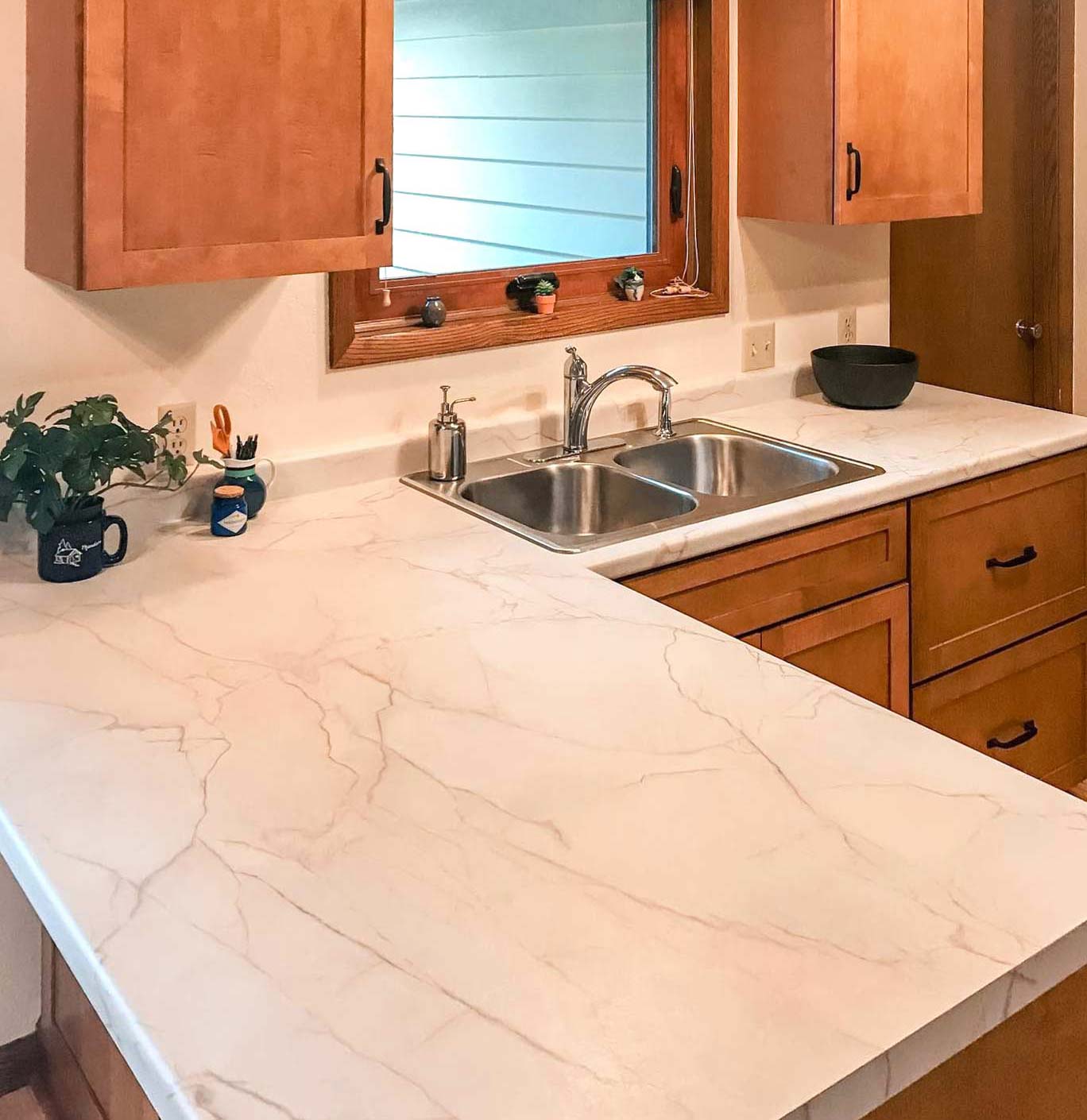 Kitchen with light marble laminate countertop