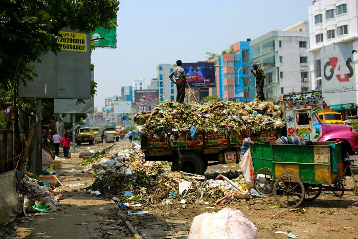 Dump Truck filled with food Across Buildings