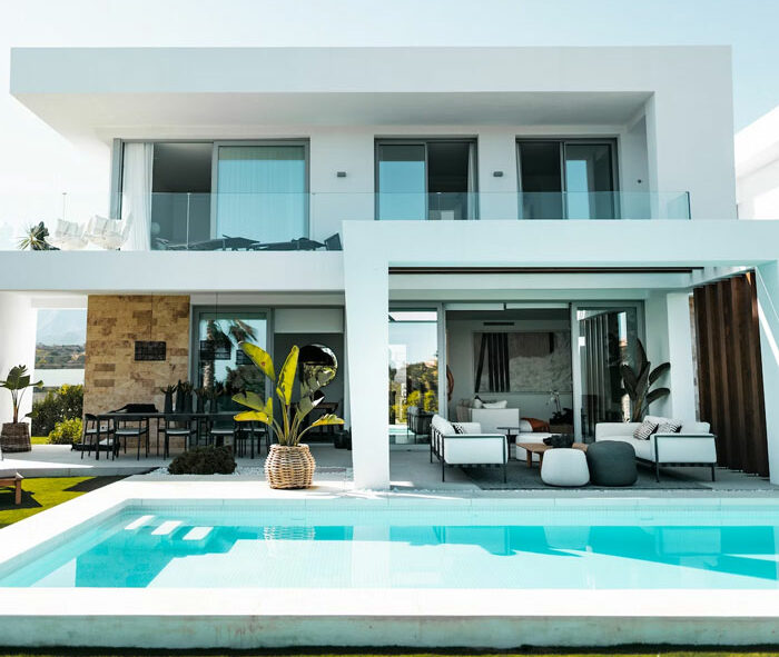 An in-ground plunge pool near white house An in-ground plunge pool near white house