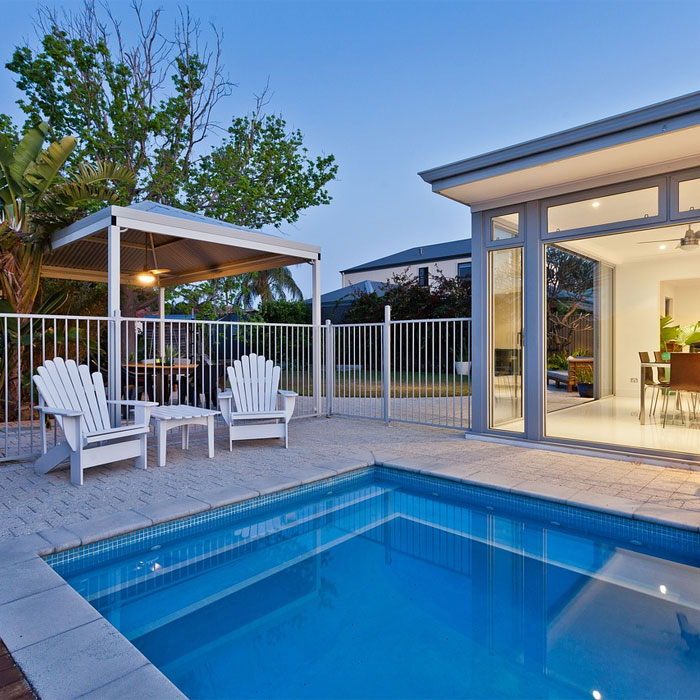 Pool with white chairs near Pool with white chairs near