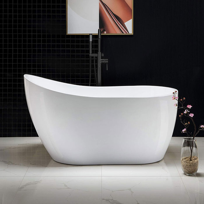 Image of white bath near black modern wall