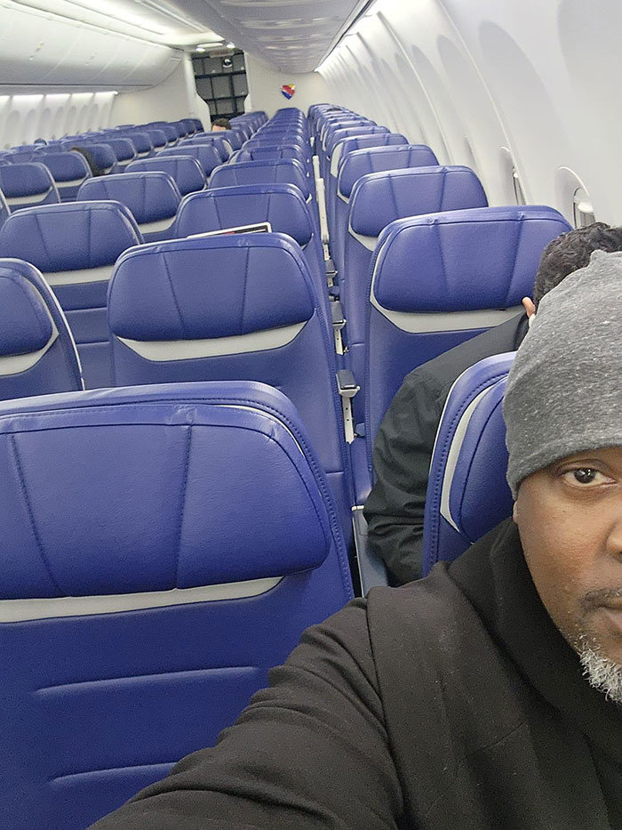 Man’s Photo Goes Viral After Fellow Passenger Sits Right Behind Him On Empty Plane